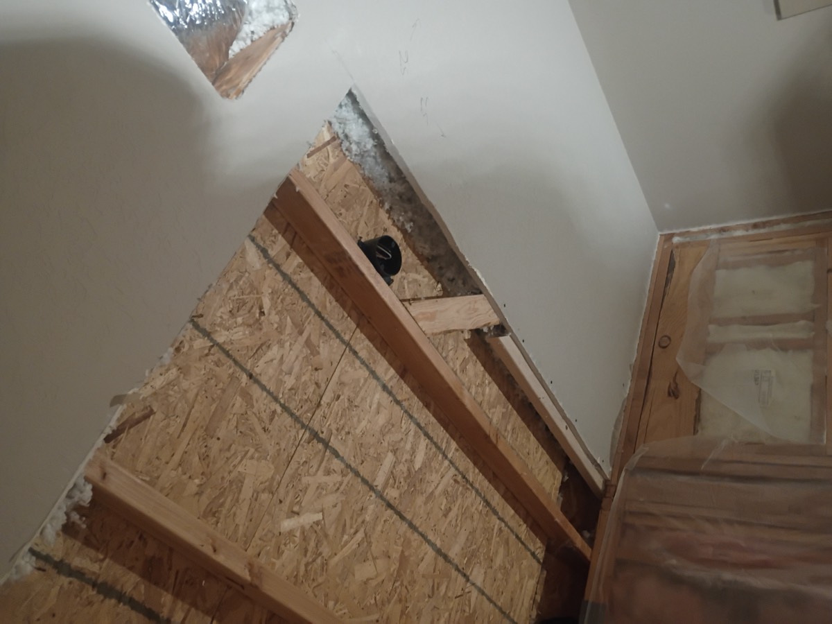 Ceiling and wall before drywall repair
