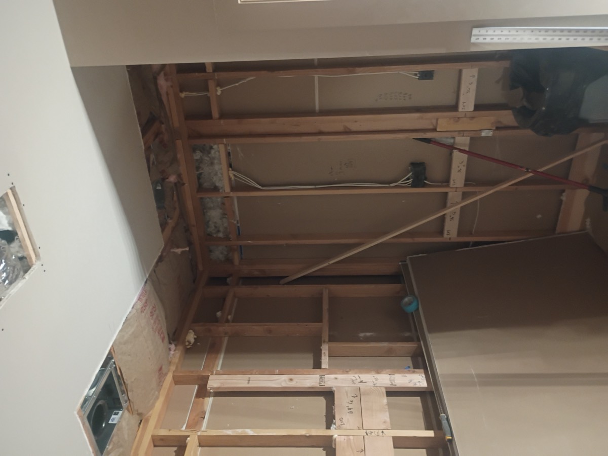 Ceiling and wall before drywall repair