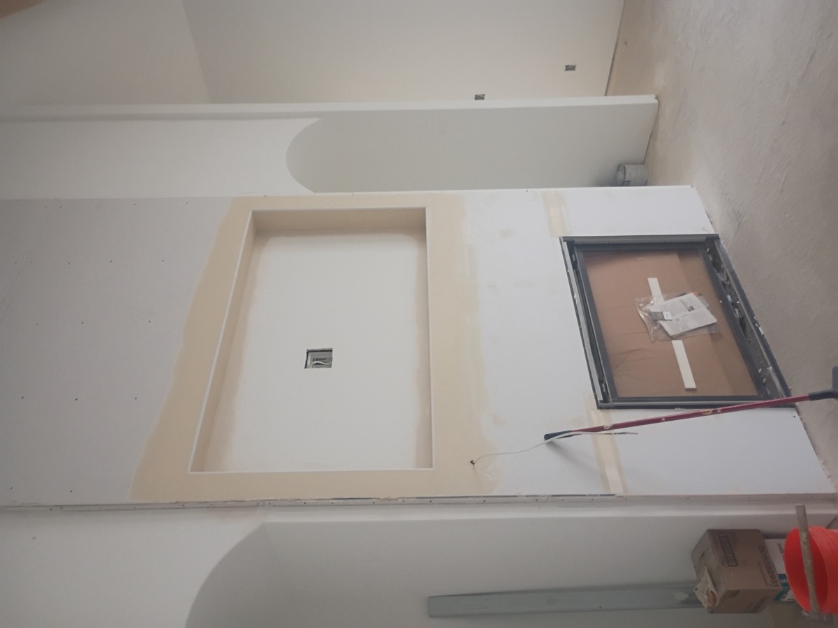 Ceiling and wall drywall repair in progress